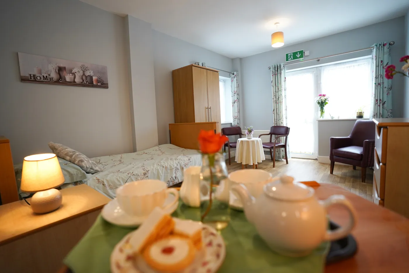 Tea for two laid on a table in a resident's bedroom